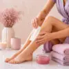 Woman waxing her lower leg at home